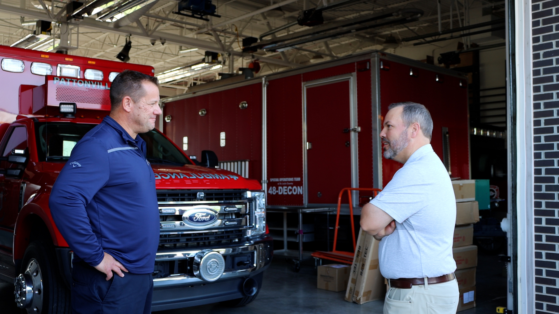 Roland Thomas, CFO of FSI, talking with Corey Irelan, Deputy Chief of Operations and Training for Pattonville Fire District