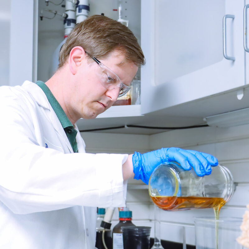 David Moray, Formulation Chemist at FSI, pouring ingredient for testing custom polyurethane formulation