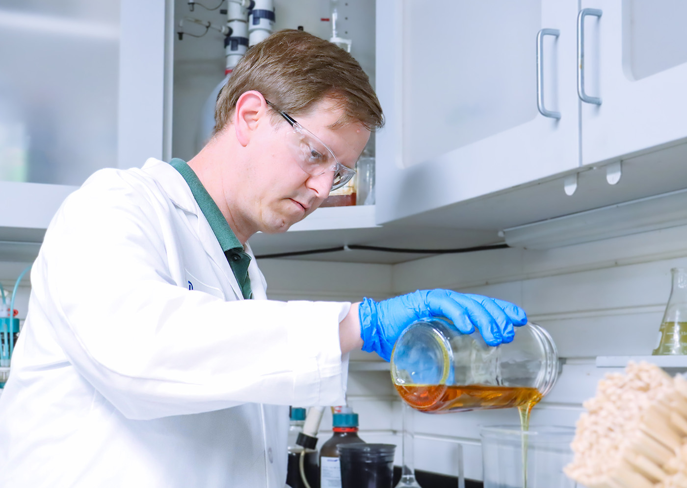 David Moray, Formulation Chemist at FSI, pouring ingredient for testing custom polyurethane formulation