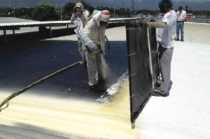 workers use ecomate spray foam to insulate roof in Jamaica