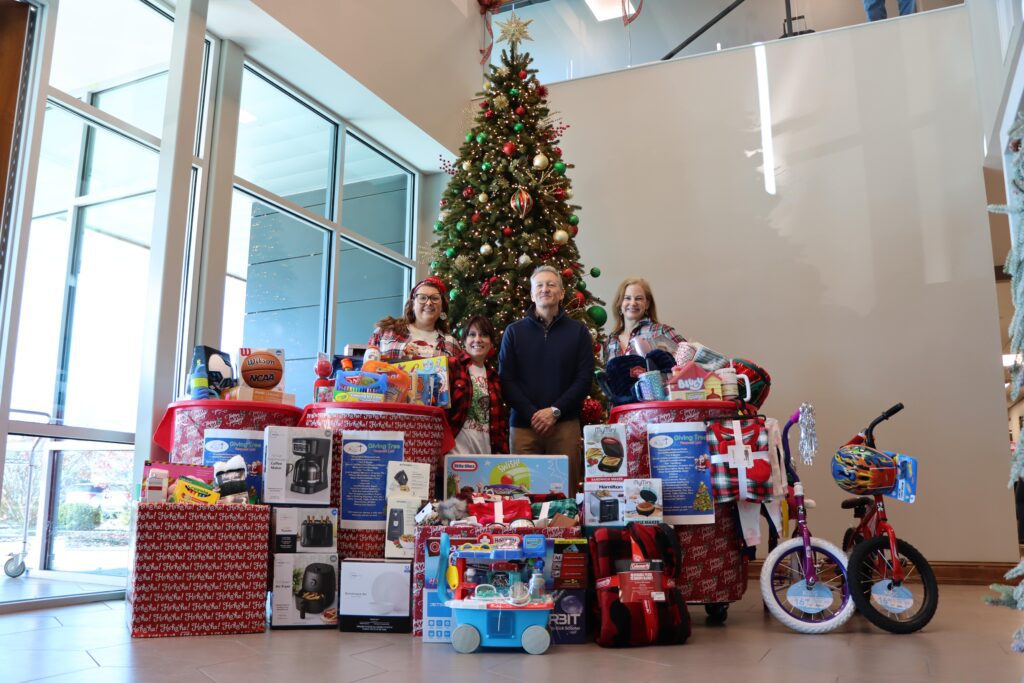 Feed My People Christmas Donations 2024_Group Photo_Holly Bono, Kristen Lance, Todd Keske, Jennifer Rush 1-min FSI proudly supports Feed My People, a local organization committed to providing food, care, and hope to families in need. Through initiatives like our Giving Tree donations, we are helping bring holiday cheer and vital support to those facing hardship. Together, we’re making a difference, ensuring families receive the care and support they deserve during the holidays and beyond.